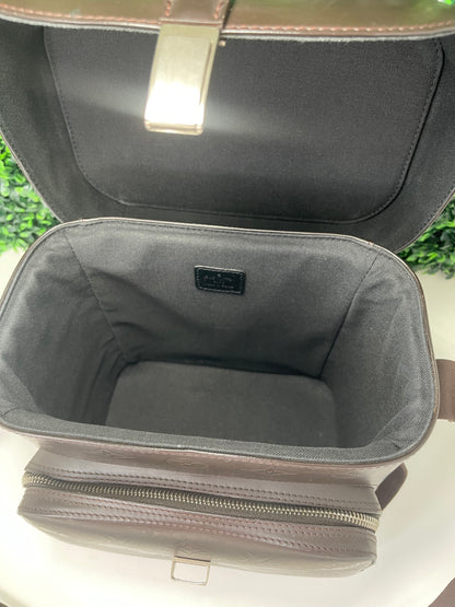 View of inside of brown handbag with compartment open 