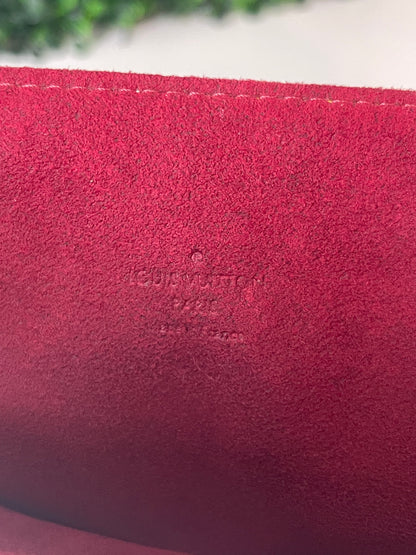 LV Heat stamp on red suede interior of a white Preowned Louis Vuitton Multicolor Beverly GM handbag.