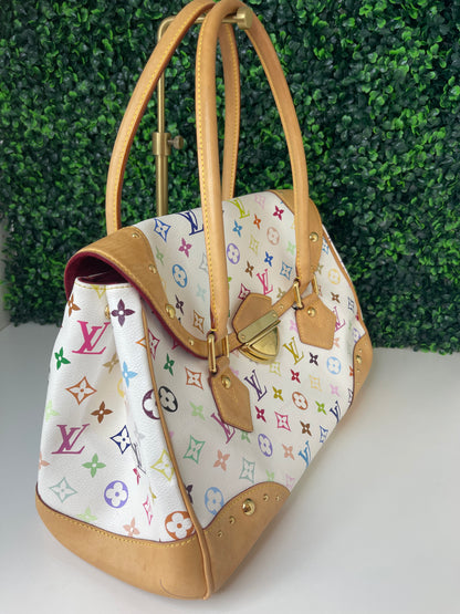 Left side view of a white Preowned Louis Vuitton Multicolor Beverly GM handbag with gold hardware and tan leather trim.