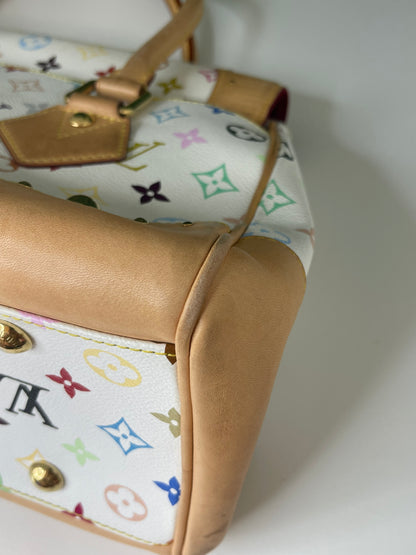 Bottom corner view of a white Preowned Louis Vuitton Multicolor Beverly GM handbag with gold hardware and tan leather trim.