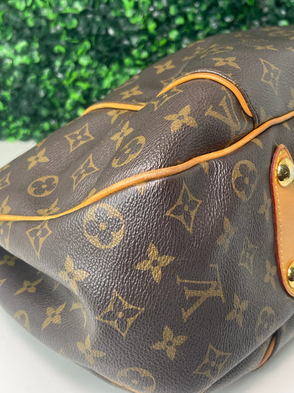 Bottom corner of exterior brown monogram Preowned Louis Vuitton Galliera PM.