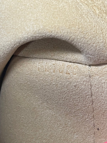 Date code on tan cloth interior of a monogram Preowned Louis Vuitton Galliera PM.