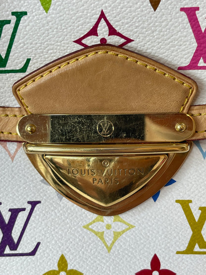 Gold hardware on clasp on front of a white Preowned Louis Vuitton Multicolor Beverly GM handbag with gold hardware and tan leather trim.
