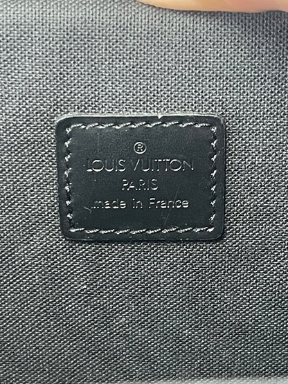 Interior label (heat stamp) inside brown handbag 
