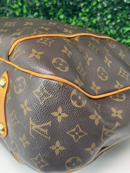 Bottom corner of exterior brown monogram Preowned Louis Vuitton Galliera PM.