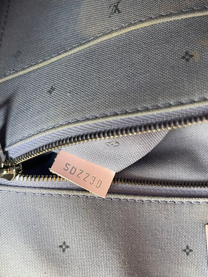 Leather date code on interior pocket of Louis Vuitton OnTheGo Escale handbag GM.  