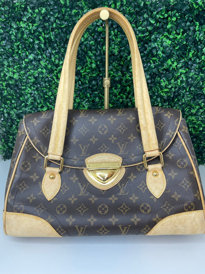 A preowned Louis Vuitton Monogram Beverly GM handbag with a brown and beige color scheme, featuring the brand's iconic LV logo, tan leather trim, displayed against a green-tone background.