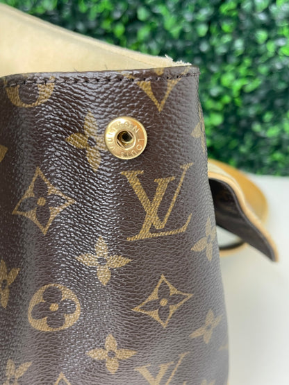 Gold button hardware on exterior of a preowned Louis Vuitton Monogram Beverly GM handbag with a brown and beige color scheme, tan leather trim, featuring the brand's iconic LV logo.