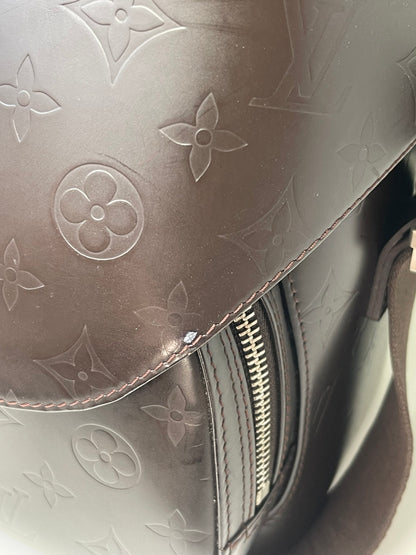 Brown handbag showing small chip in corner 