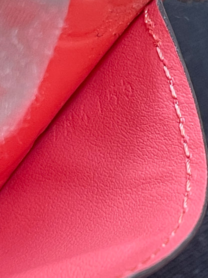 Date code stamped on interior pocket of preowned Louis Vuitton long wallet with vernis leather.