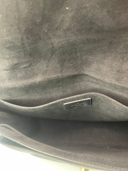 Downward view of the Black cloth interior with inside of a preowned Louis Vuitton Marignan handbag. 