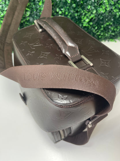 Top of brown handbag and cloth strap 