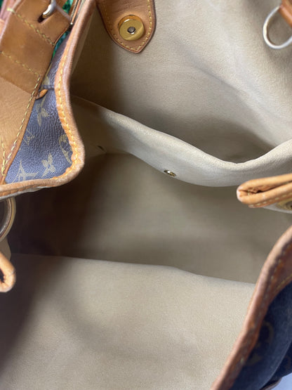 Tan cloth interior of a monogram Preowned Louis Vuitton Galliera PM.