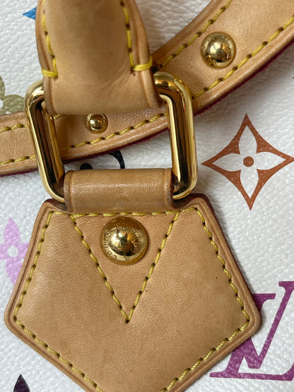 Leather chaps on exterior of a white Preowned Louis Vuitton Multicolor Beverly GM handbag.